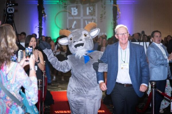 MountainOne President and CEO Robert Fraser (right) and MountainOne Spokesgoat Mo at the Boston Business Journal’s 2025 Best Places to Work celebration.