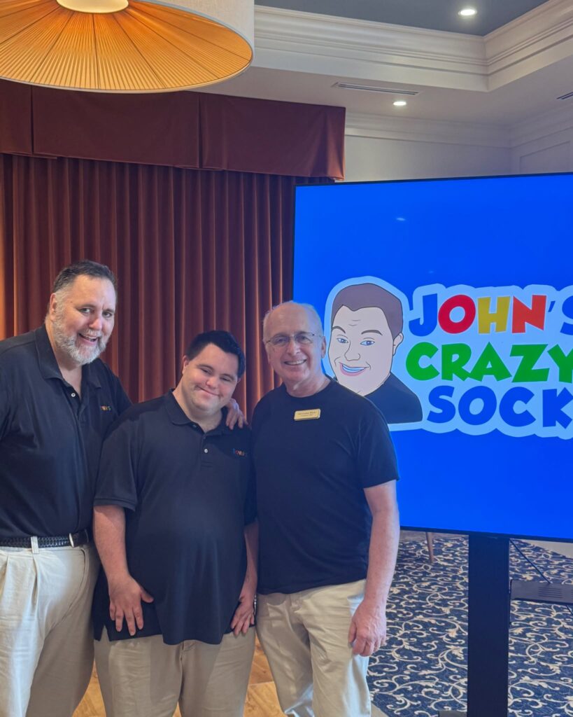 Chris White with Johns Crazy Socks founders John Mark Cronin